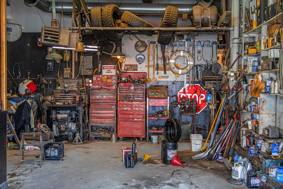 A well-equipped auto garage workspace with tools and parts storage