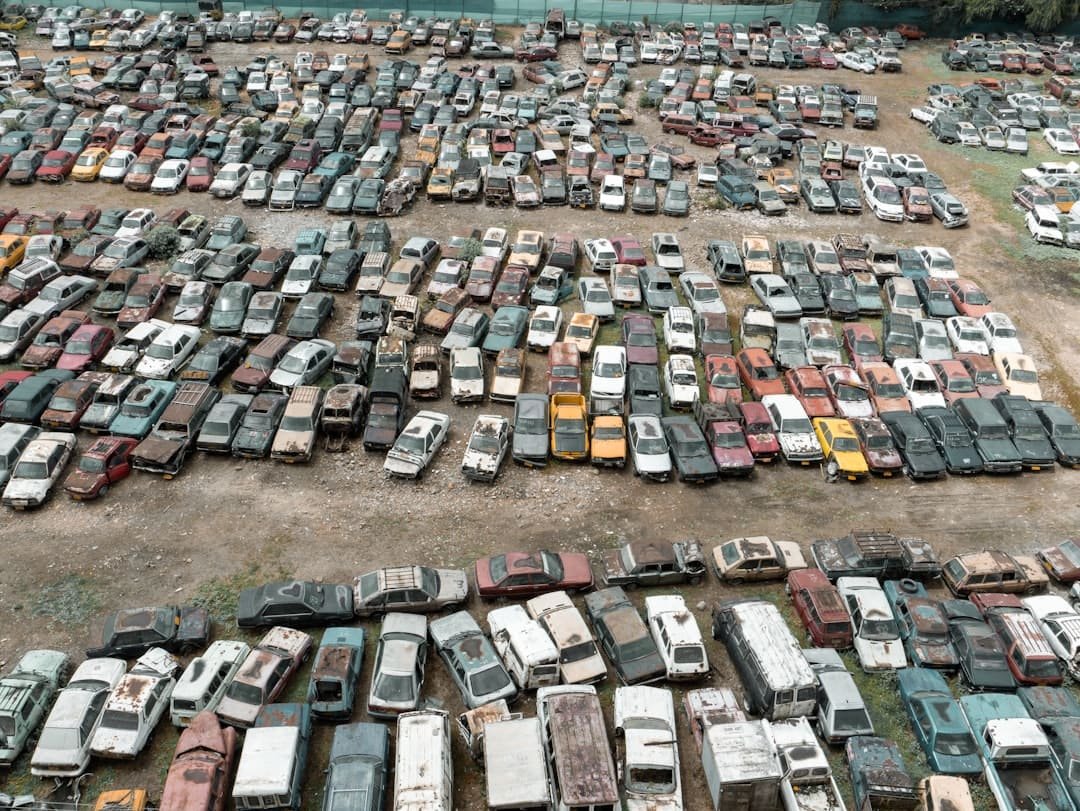 Aerial view of rows of salvaged vehicles at an auto salvage yard