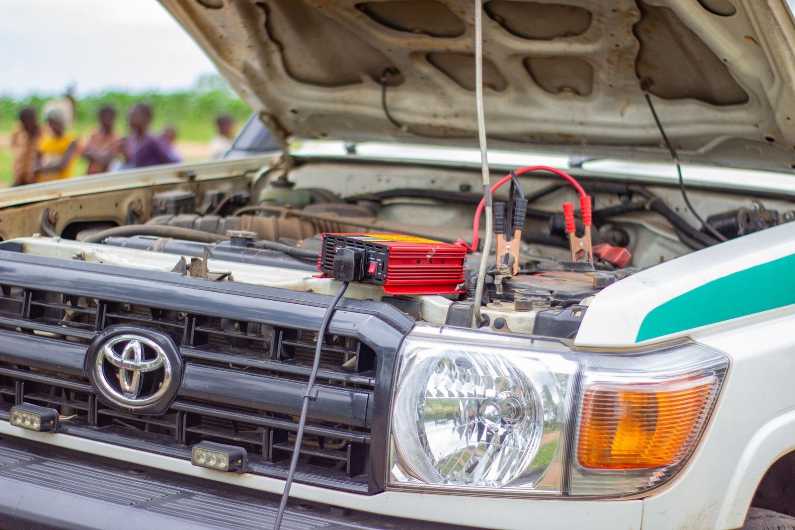 A battery charger connected to a vehicle battery