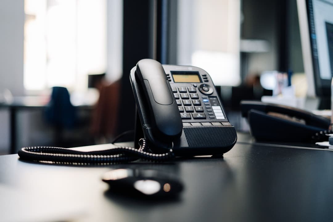 Customer service representative on a phone call in an office