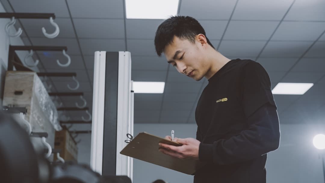Technician performing a quality inspection on an auto part