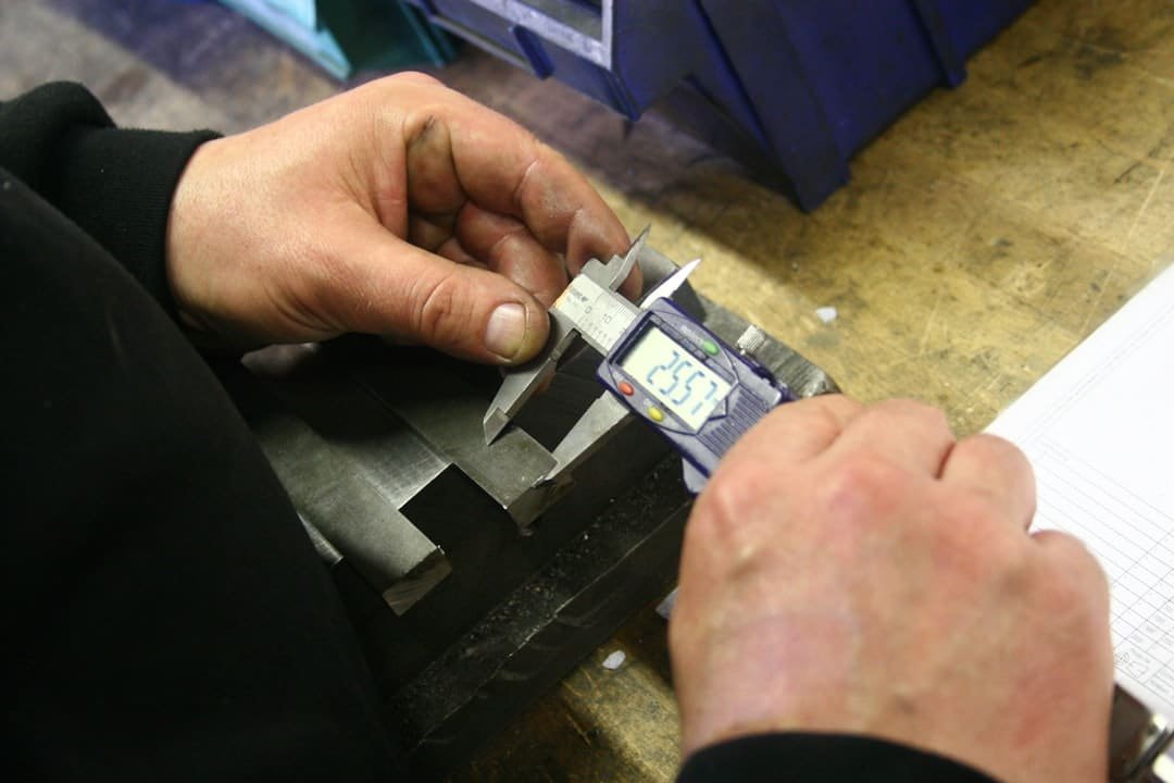 Quality inspection stamp being applied to a checked part