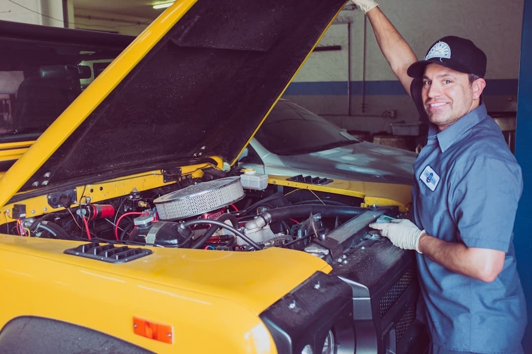 Technician comparing two auto parts for fitment