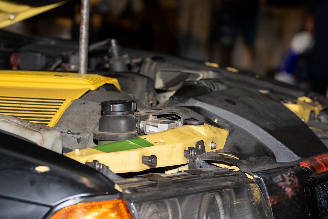 An engine bay bracket and bolt closeup
