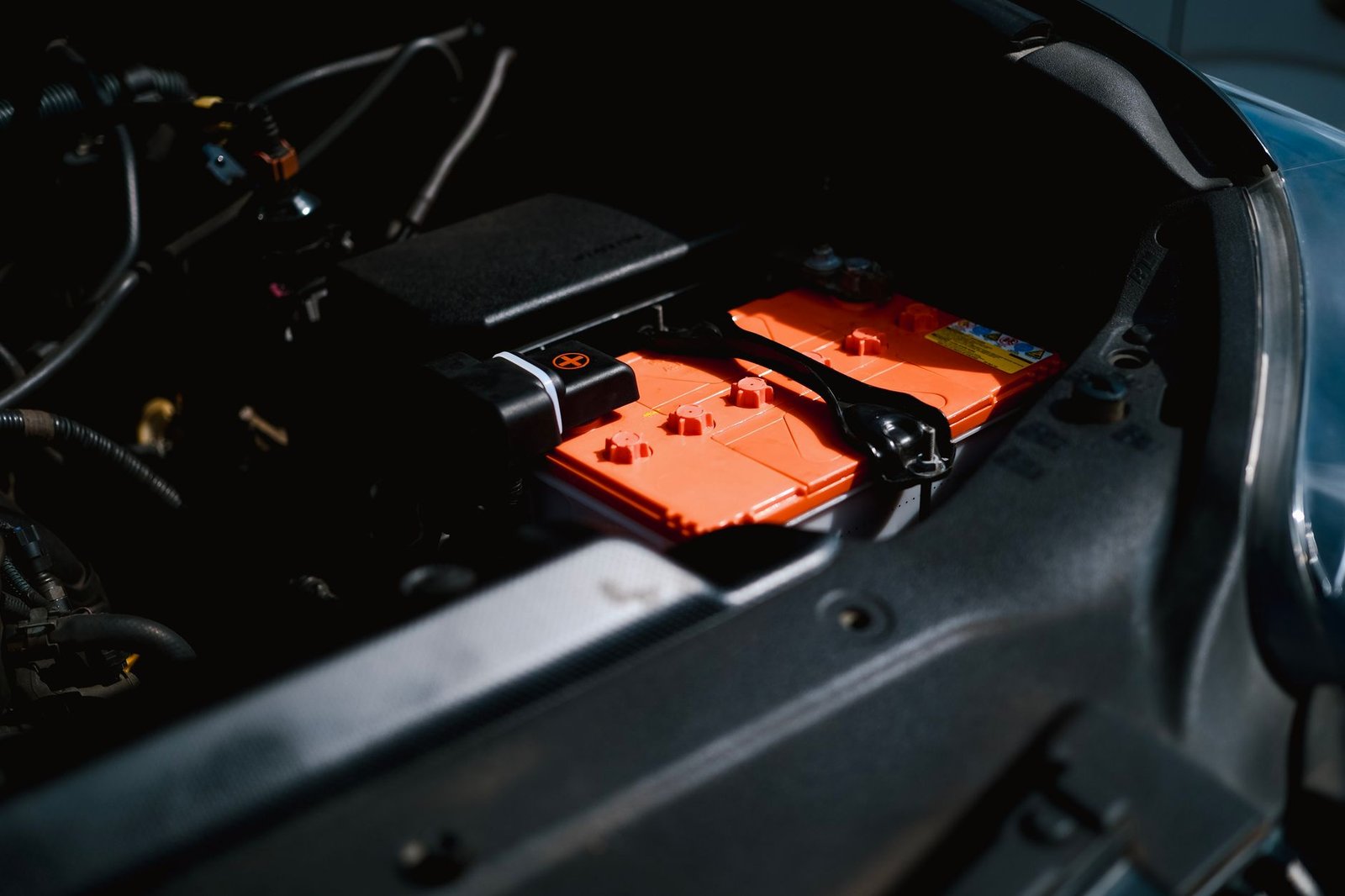 A car battery in an engine bay