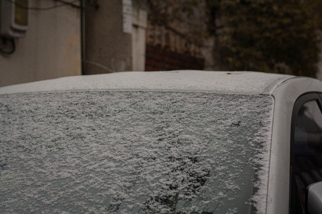 A car covered in snow and frost on a winter morning