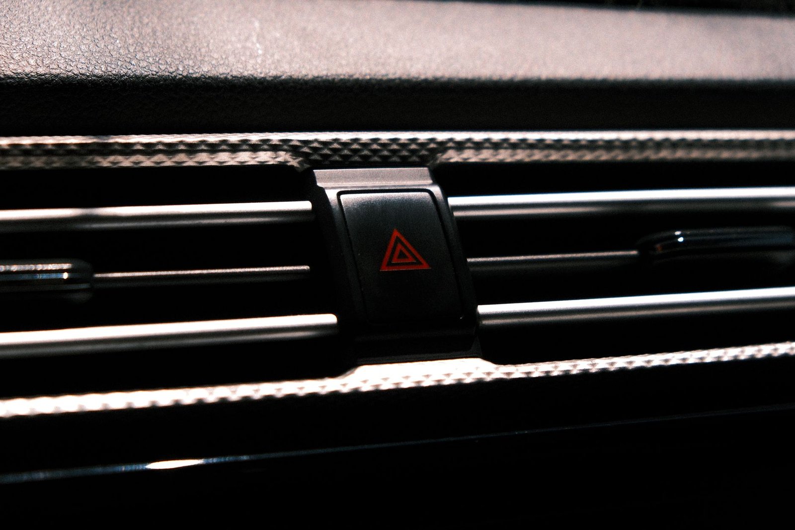 A car hazard light switch closeup