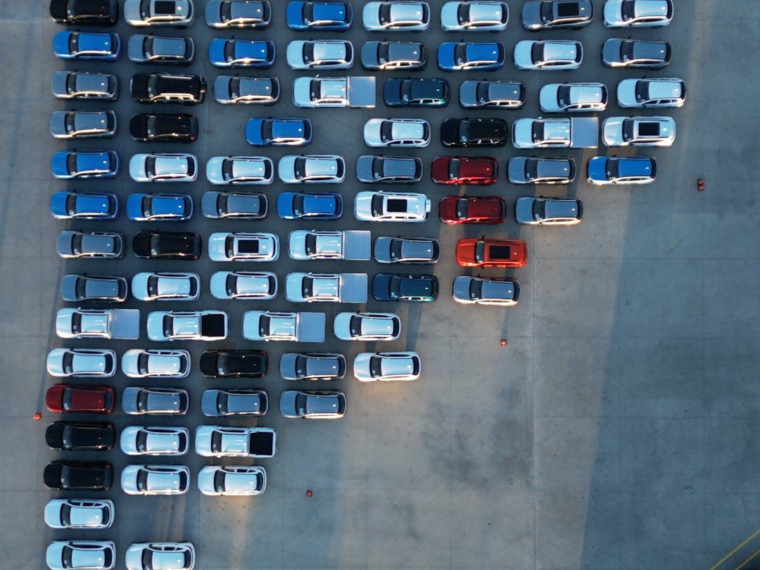 Aerial view of rows of vehicles at a dealership lot