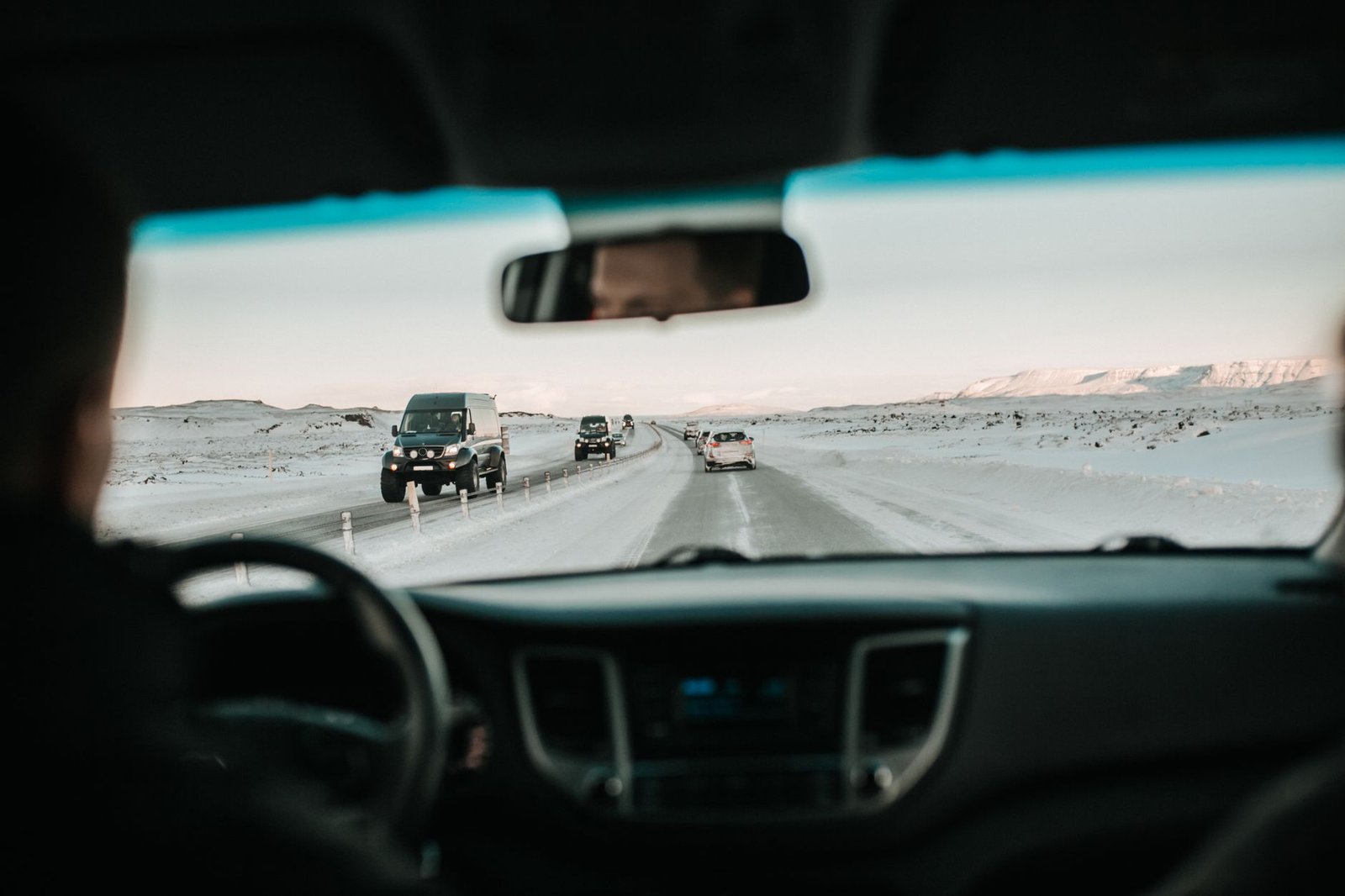 A car driving on a snow-covered road