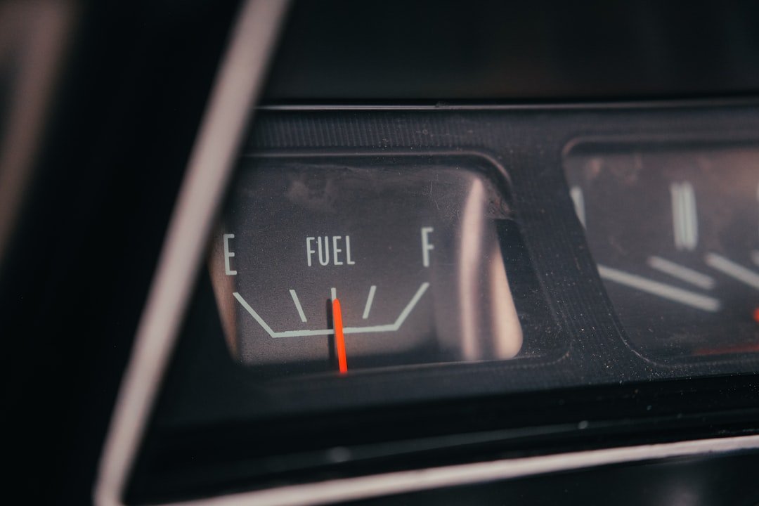 A fuel gauge needle near empty