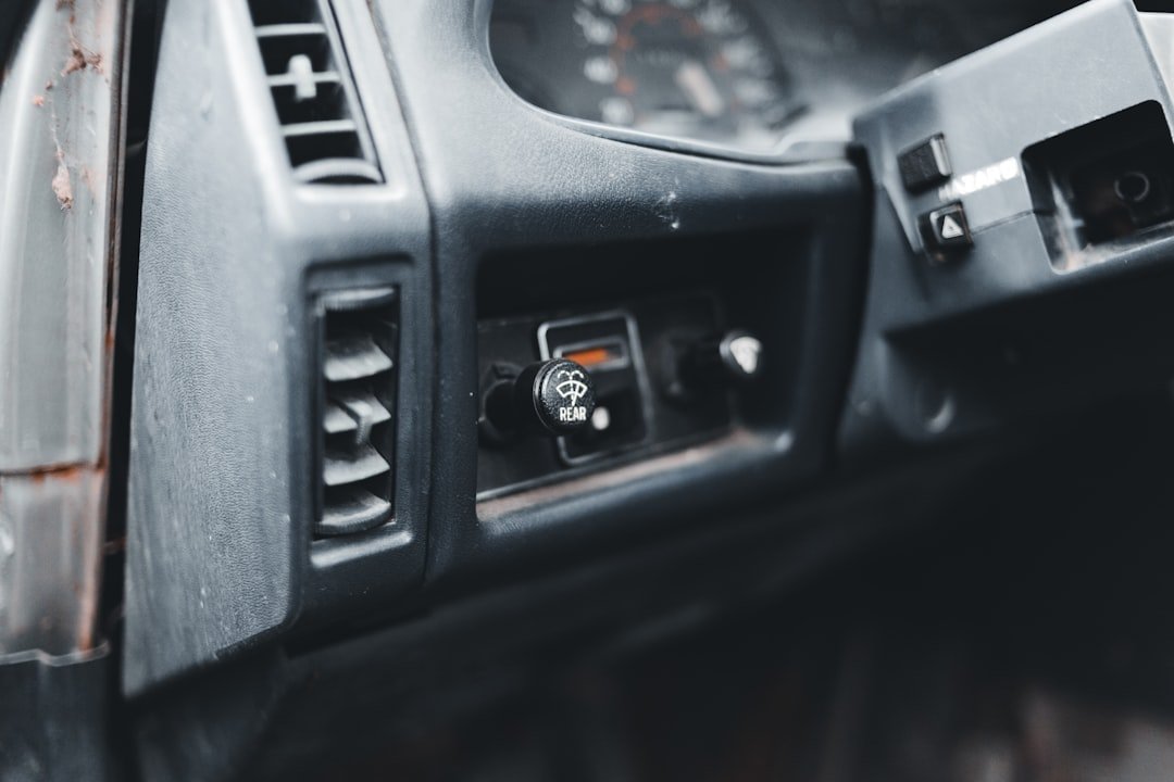 A vintage dashboard fan switch panel