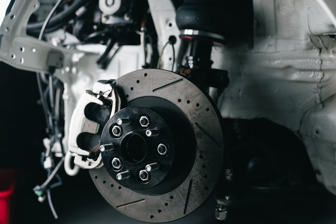 Car wheel well showing the strut and suspension assembly