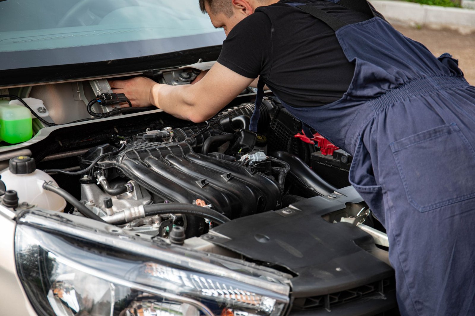 A stock vehicle engine bay open for inspection