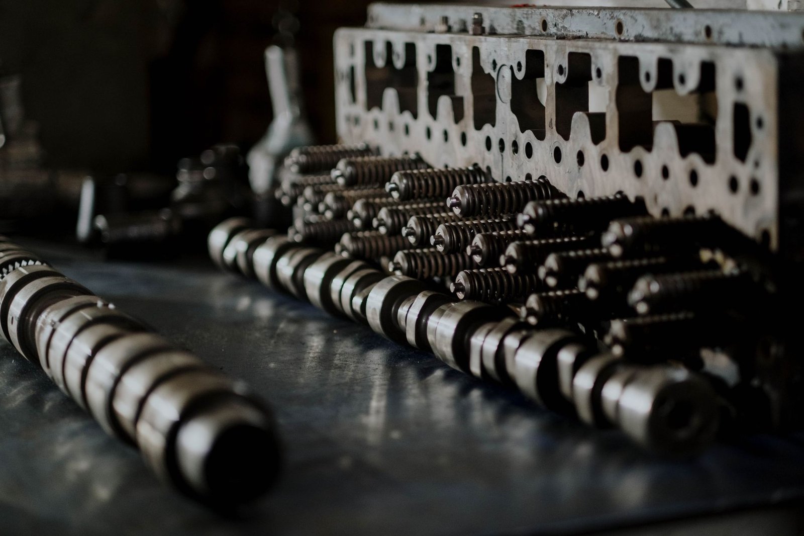 An engine camshaft with valve springs visible