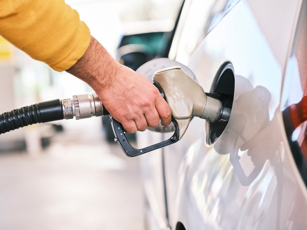 Filling a car with fuel at a gas station