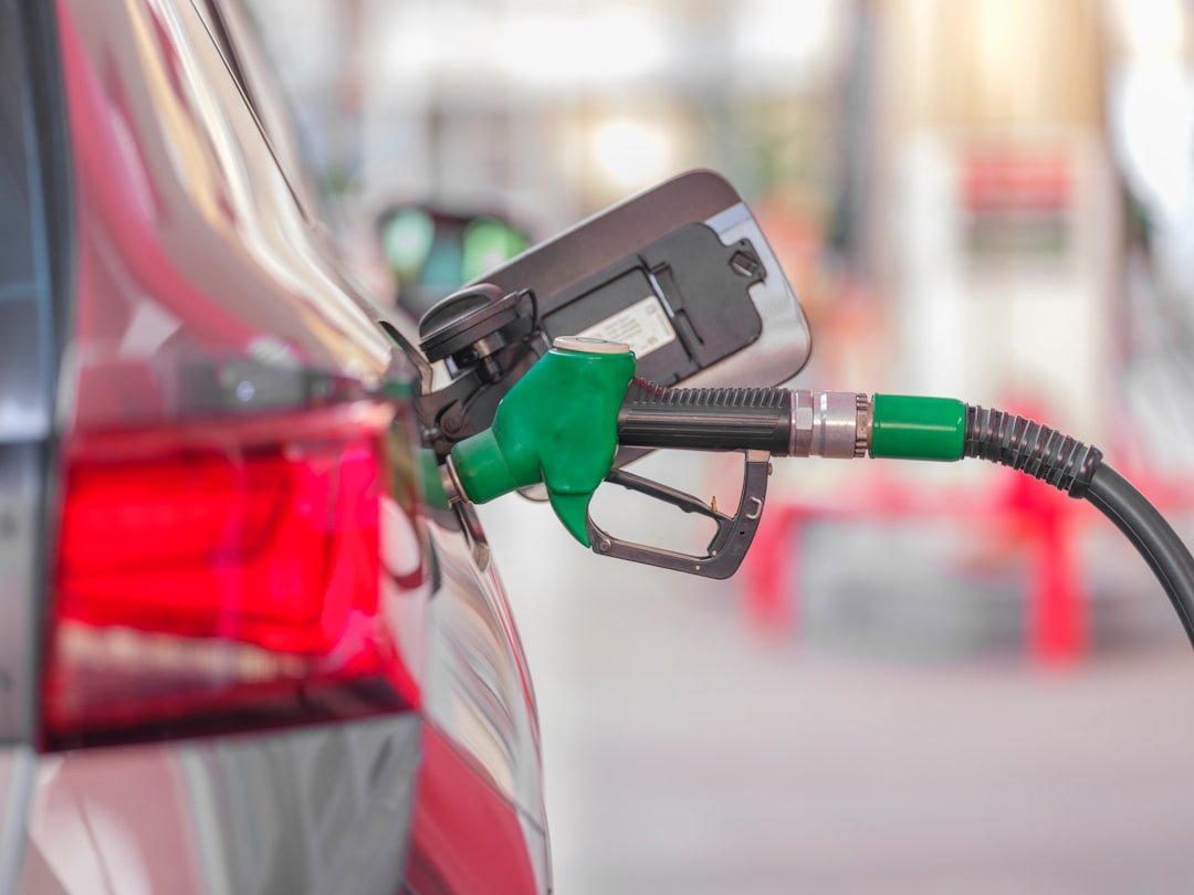 Filling a car's fuel tank at a gas station
