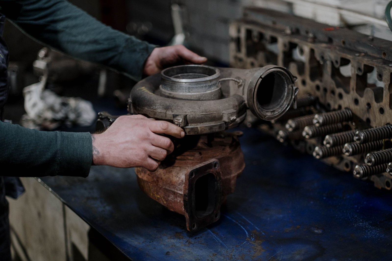 Inspecting a turbocharger part on a workbench