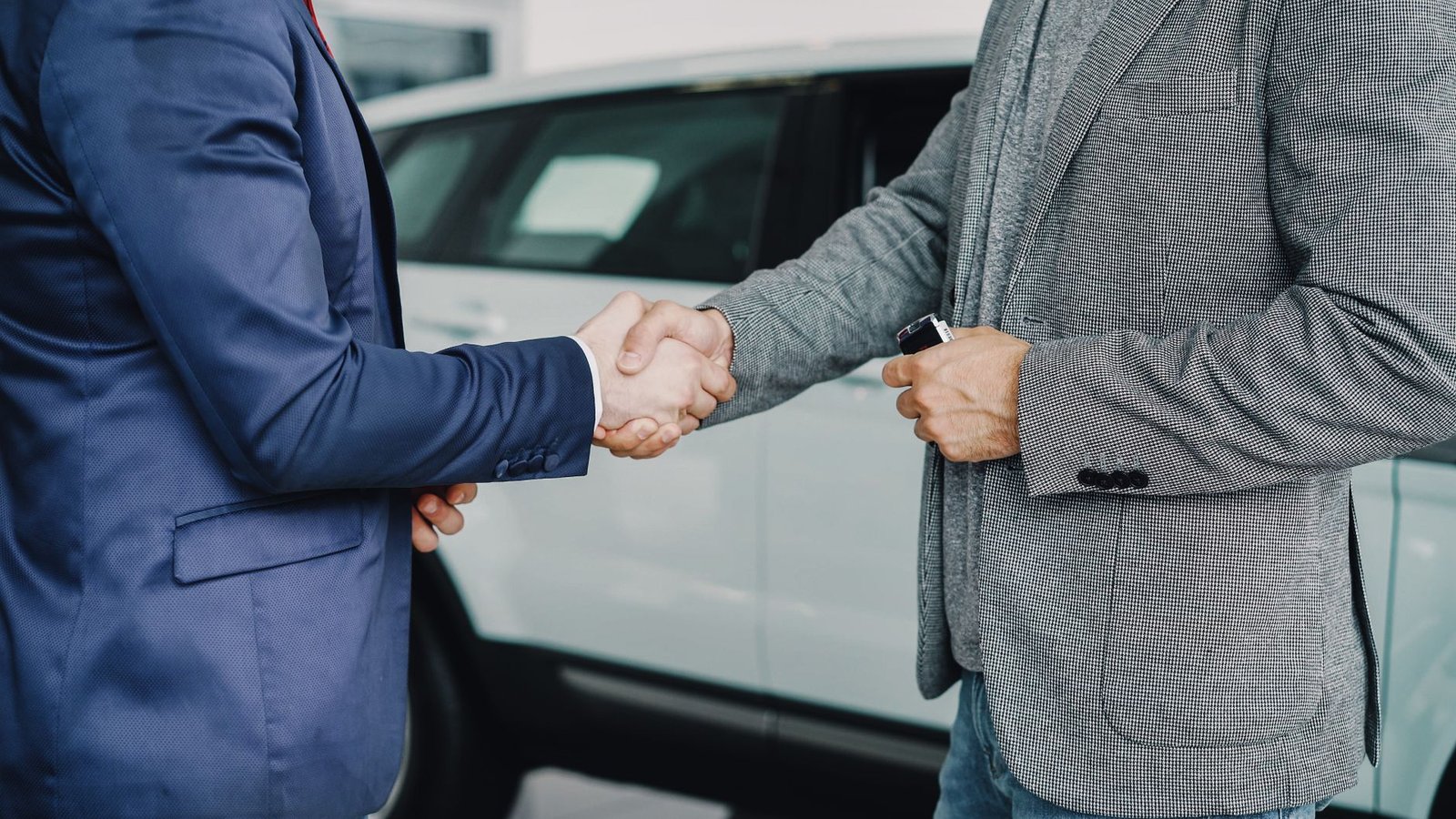 A handshake confirming a parts purchase agreement