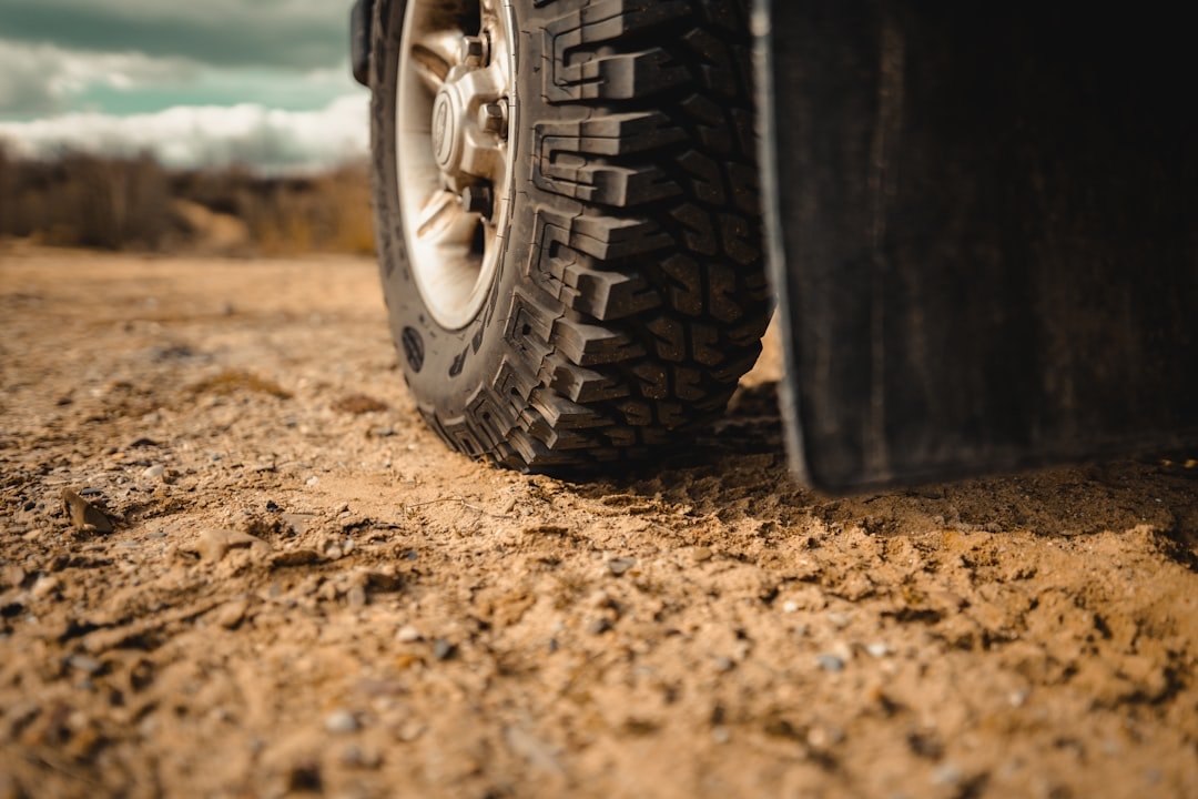An off-road tire on dirt terrain