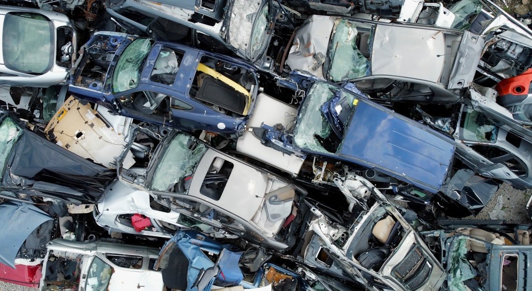 Aerial view of crushed cars at a scrap yard
