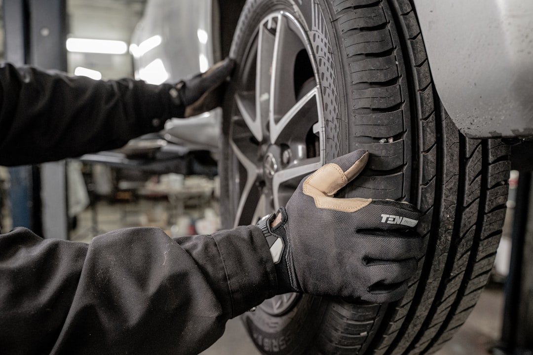 Checking tire wear pattern on the front of a vehicle