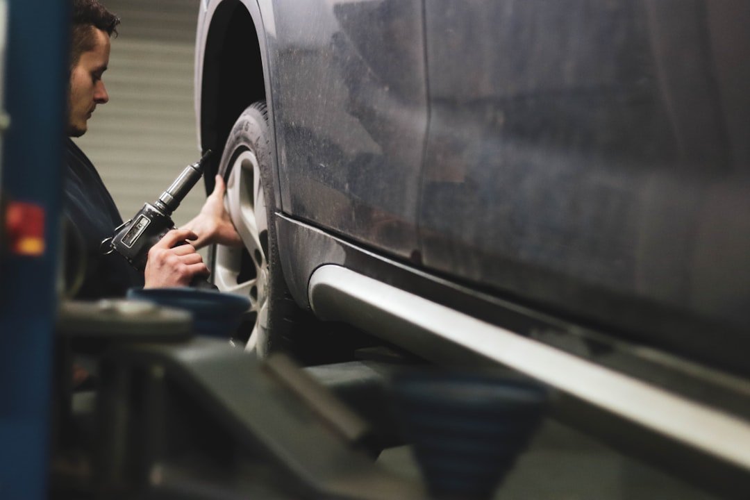 A mechanic working on a wheel