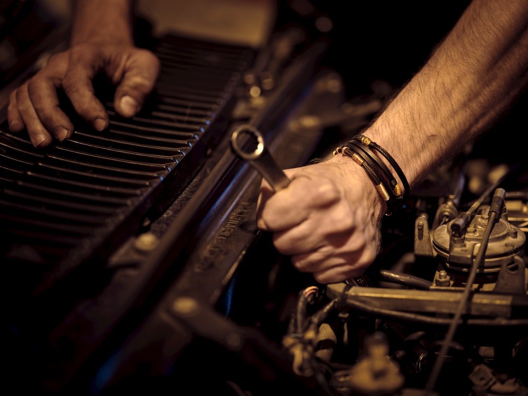 Hands working on an engine part