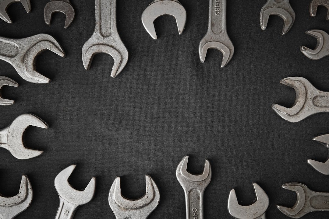 A circle of wrenches on a dark background