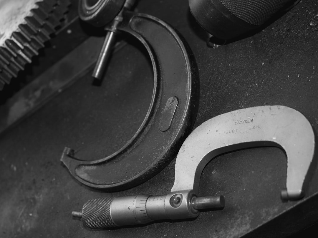 A micrometer measuring tool used to check part thickness