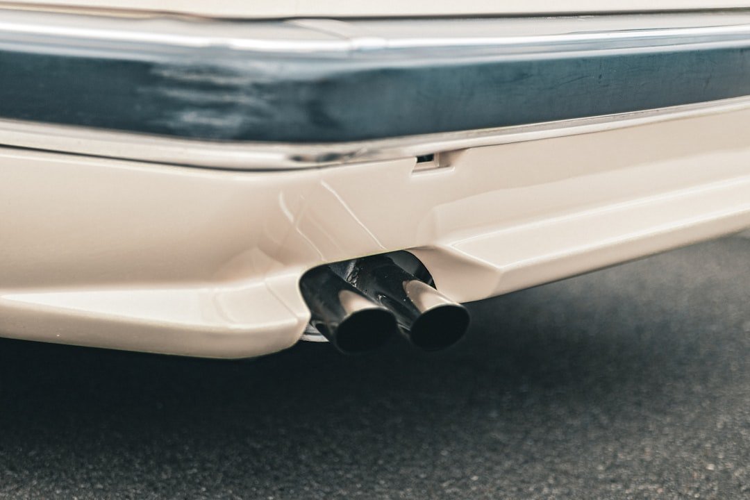 The exhaust tailpipe of an ordinary sedan
