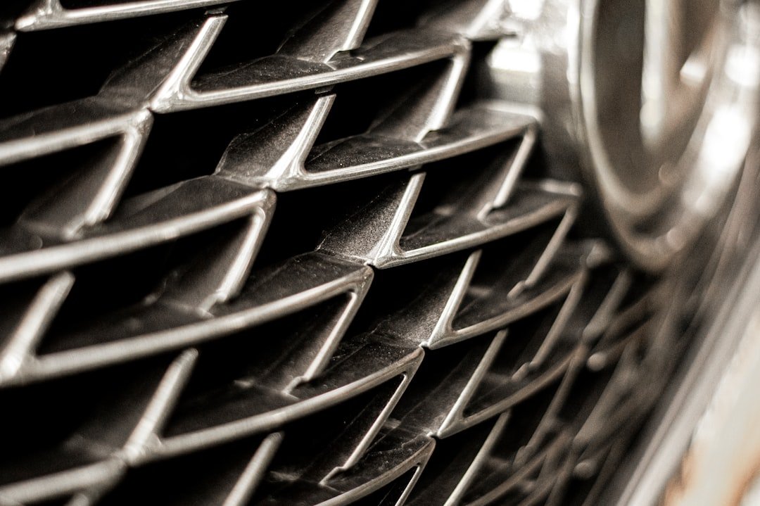 Close-up of a vehicle front grille, behind which the radiator is mounted