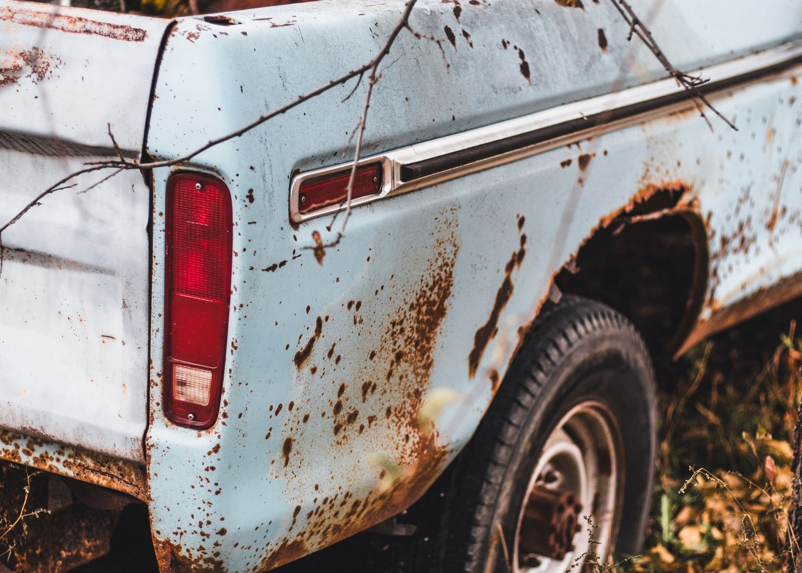 A rust hole in a car wheel well