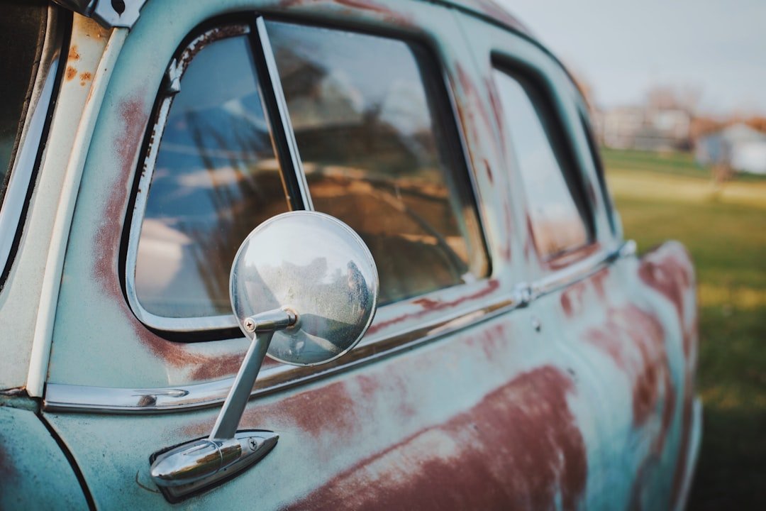 A rusted fender on a vintage car