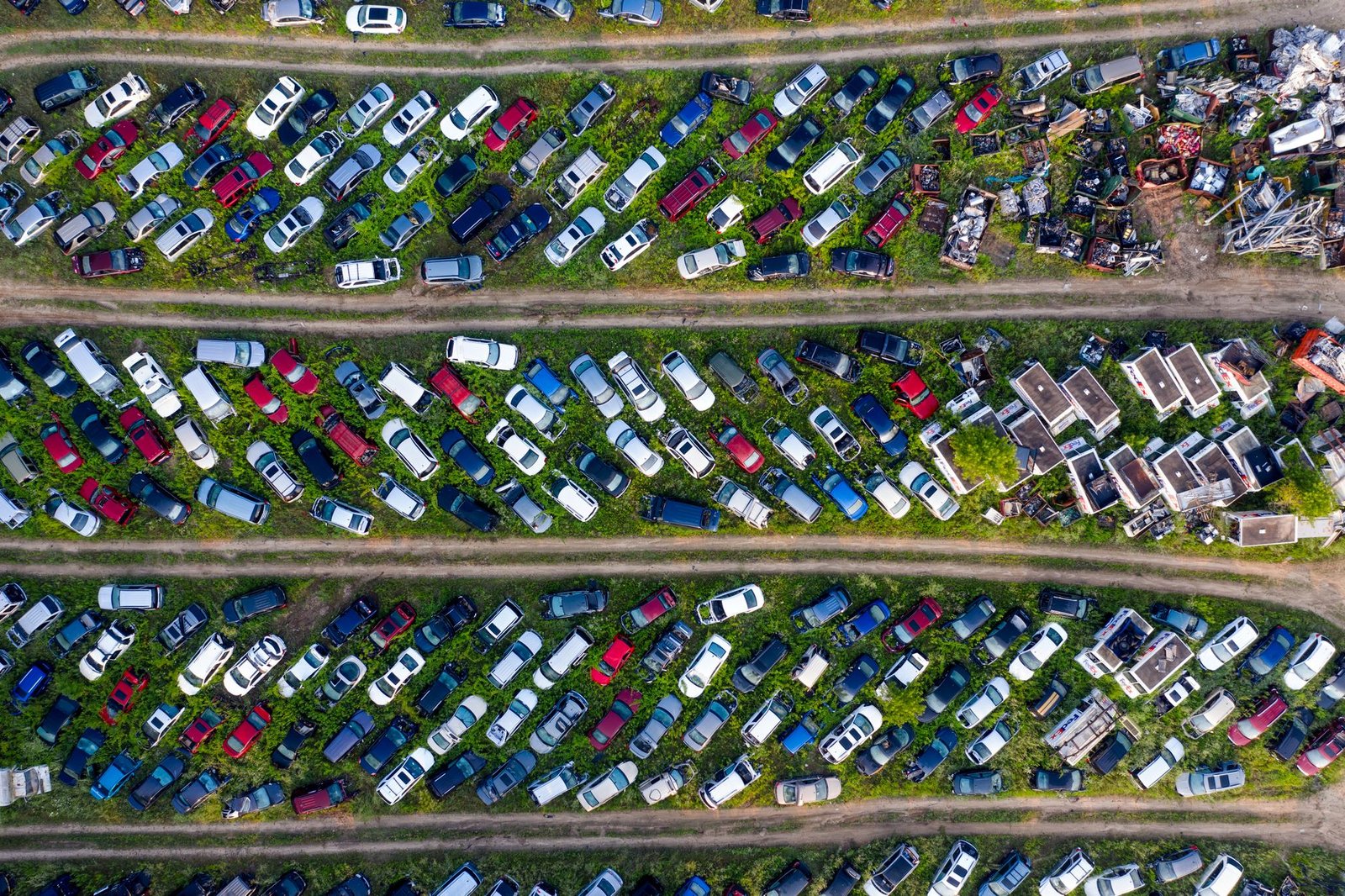 Aerial view of rows of vehicles in a salvage yard