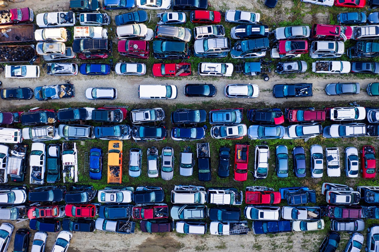 Aerial view of rows of vehicles at a salvage yard