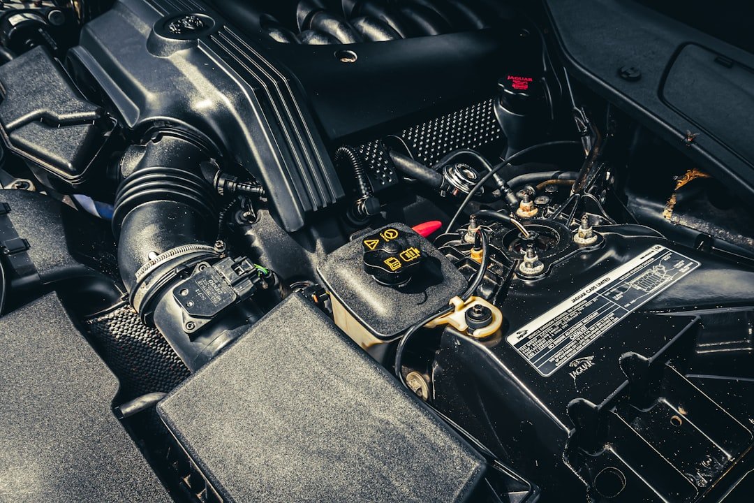 A fluid reservoir cap under the hood