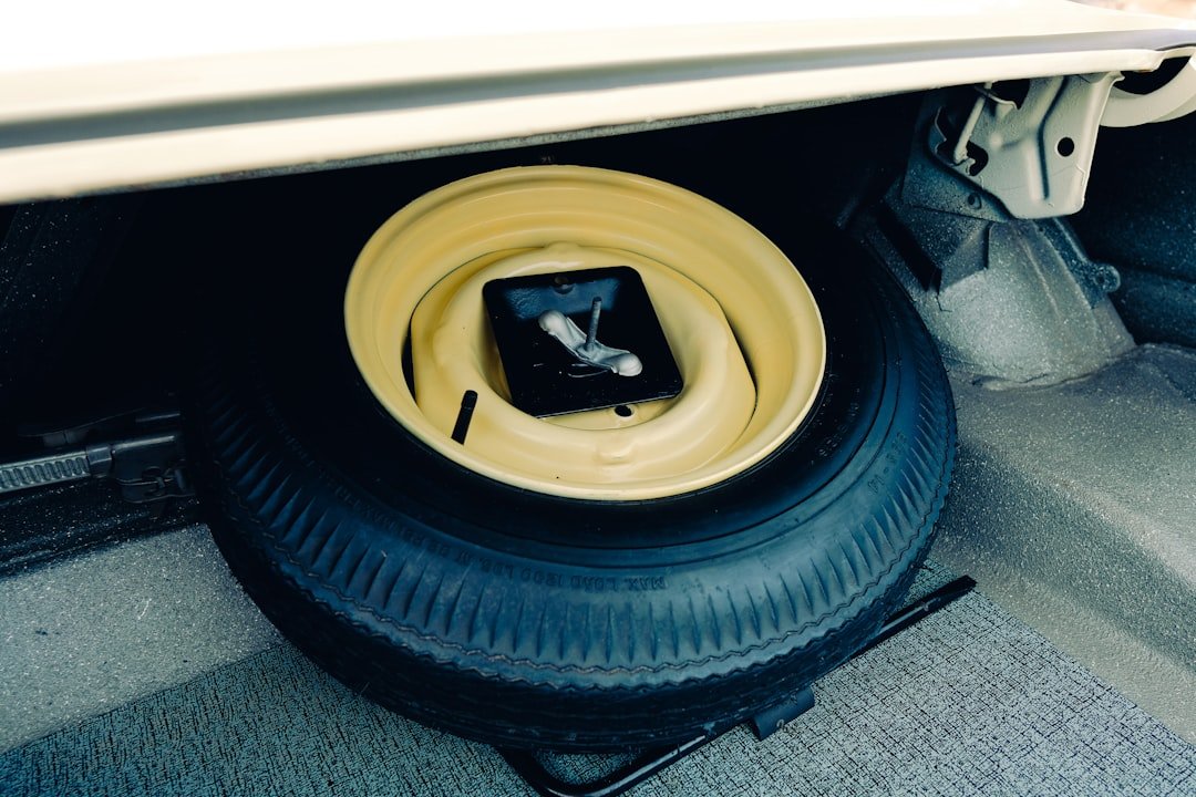 A spare tire in a vehicle's trunk compartment
