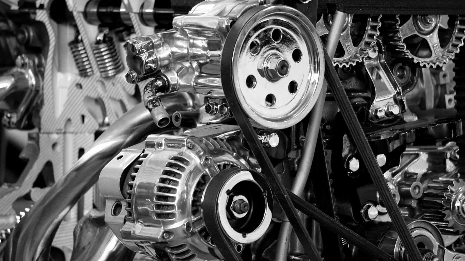 A chrome engine bay with alternator and pulleys
