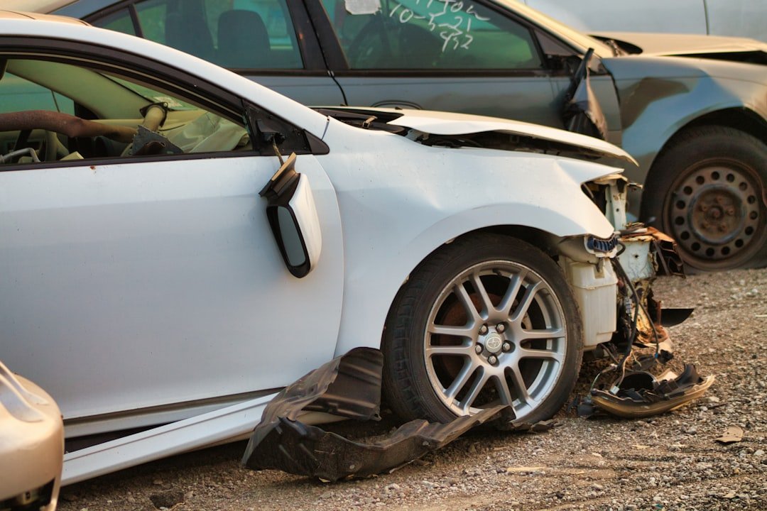Side impact damage on a wrecked vehicle at a salvage yard