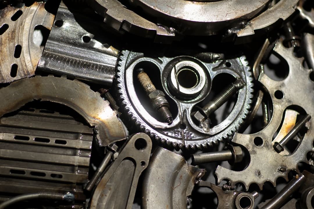 Assorted used auto parts including filters, hoses, and hardware