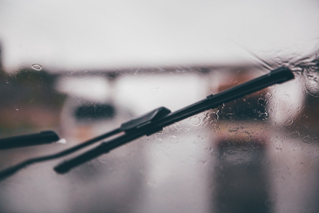 A windshield wiper blade in the rain