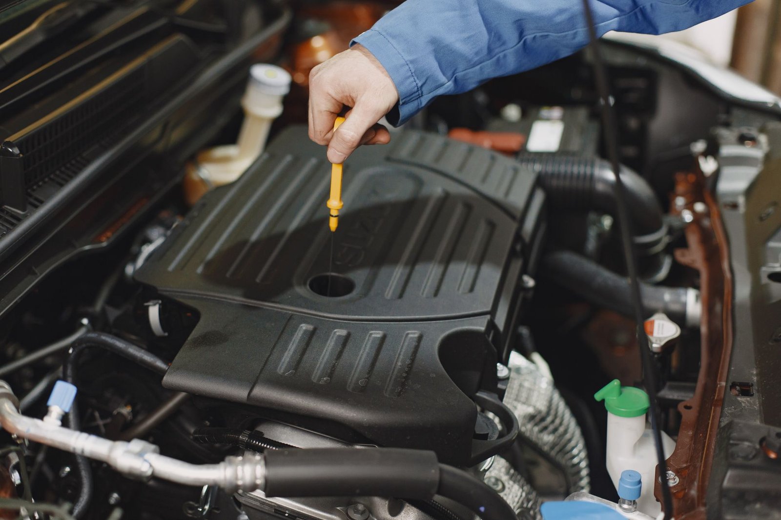 Checking engine oil level on a dipstick